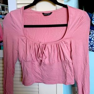 pink crop top with low cut